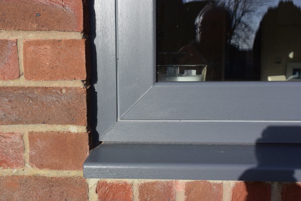 Anthracite grey PVCu flush window corner