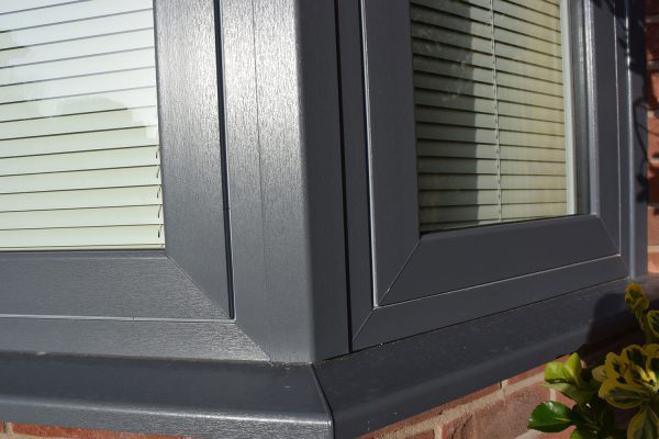 dark grey pvcu flush sash bay window corner