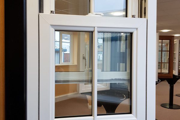PVCu sliding sash windows in showroom