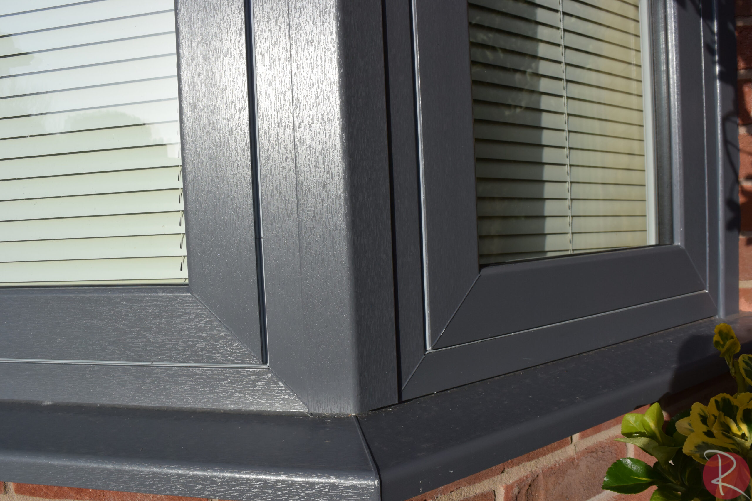 dark grey pvcu flush sash bay window corner