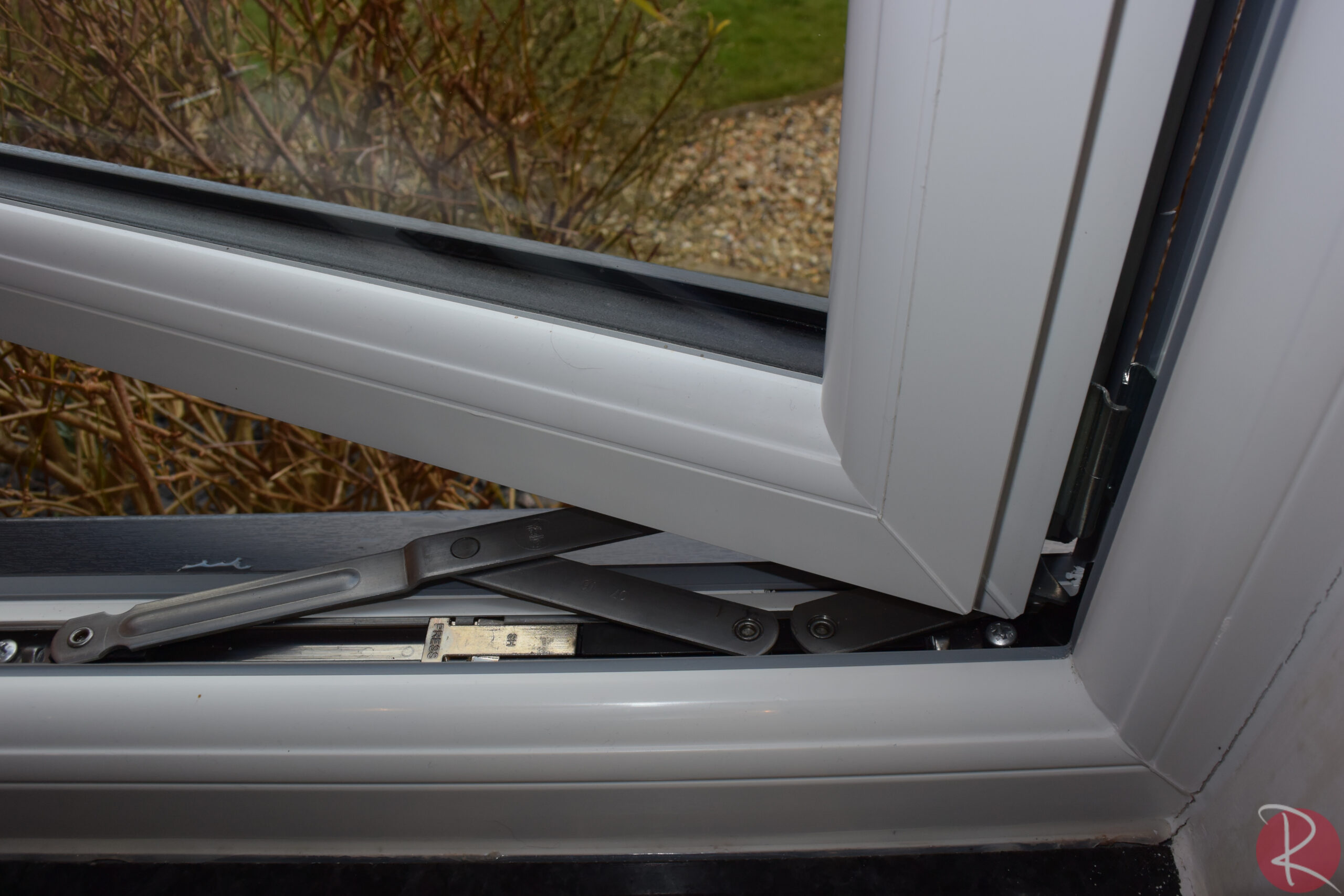 Sculptured white window hardware