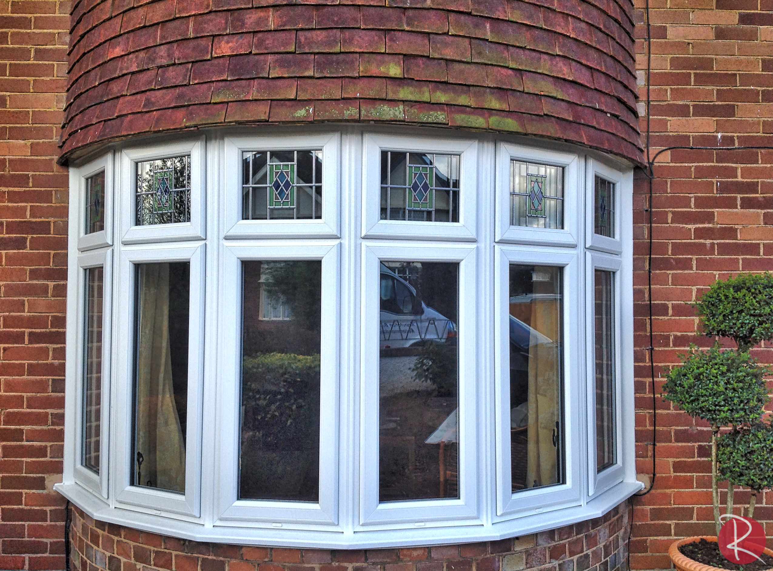white PVCu bow window with double glazing